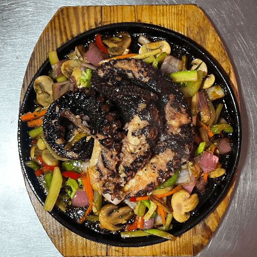Pulpo a la jardinera con verduras salteadas